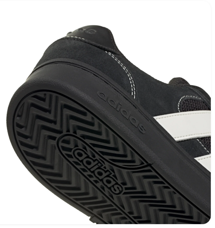 Adidas Black Low-Top Sneakers with White Stripes and Contrast Stitching