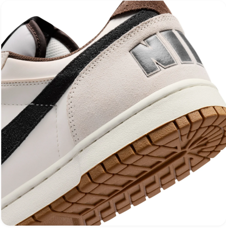 Nike White and Cream Low-Top Sneakers with Black Swoosh and Gum Sole