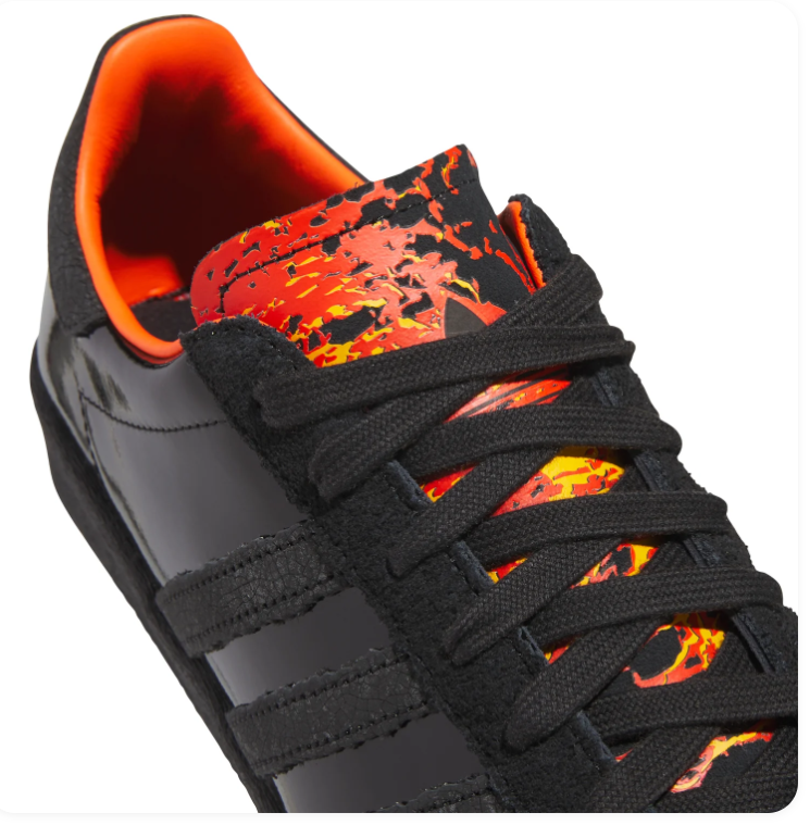 Adidas Black Glossy Low-Top Sneakers with Orange Lining and Graphic Tongue