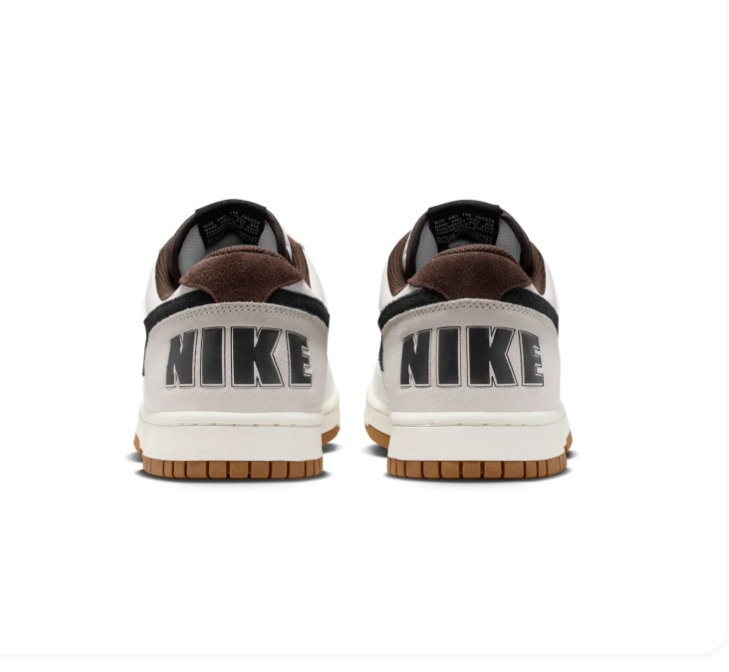 Nike White and Cream Low-Top Sneakers with Black Swoosh and Gum Sole