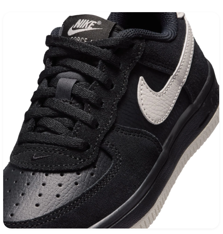Nike Black Low-Top Sneakers with Cream Swoosh and Two-Tone Sole