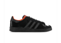 Adidas Black Glossy Low-Top Sneakers with Orange Lining and Graphic Tongue