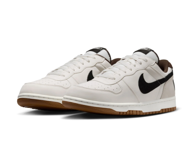Nike White and Cream Low-Top Sneakers with Black Swoosh and Gum Sole