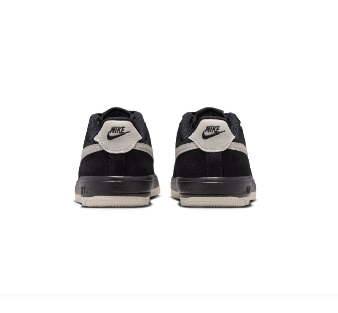 Nike Black Low-Top Sneakers with Cream Swoosh and Two-Tone Sole