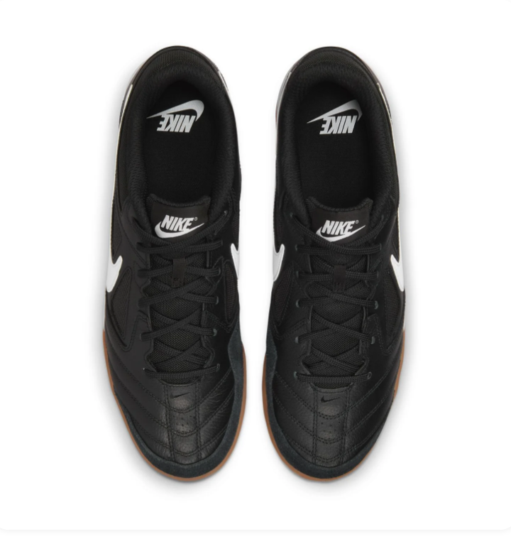 Nike Black Low-Top Sneakers with White Swoosh and Gum Sole