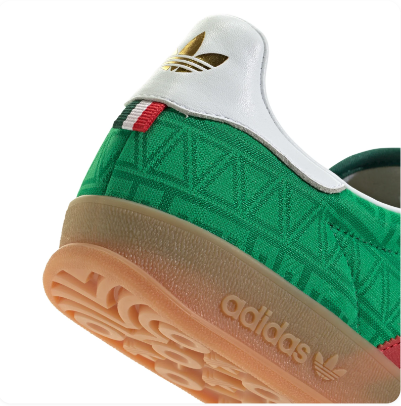 Adidas Green Patterned Sneakers with Red Stripes and Gum Sole